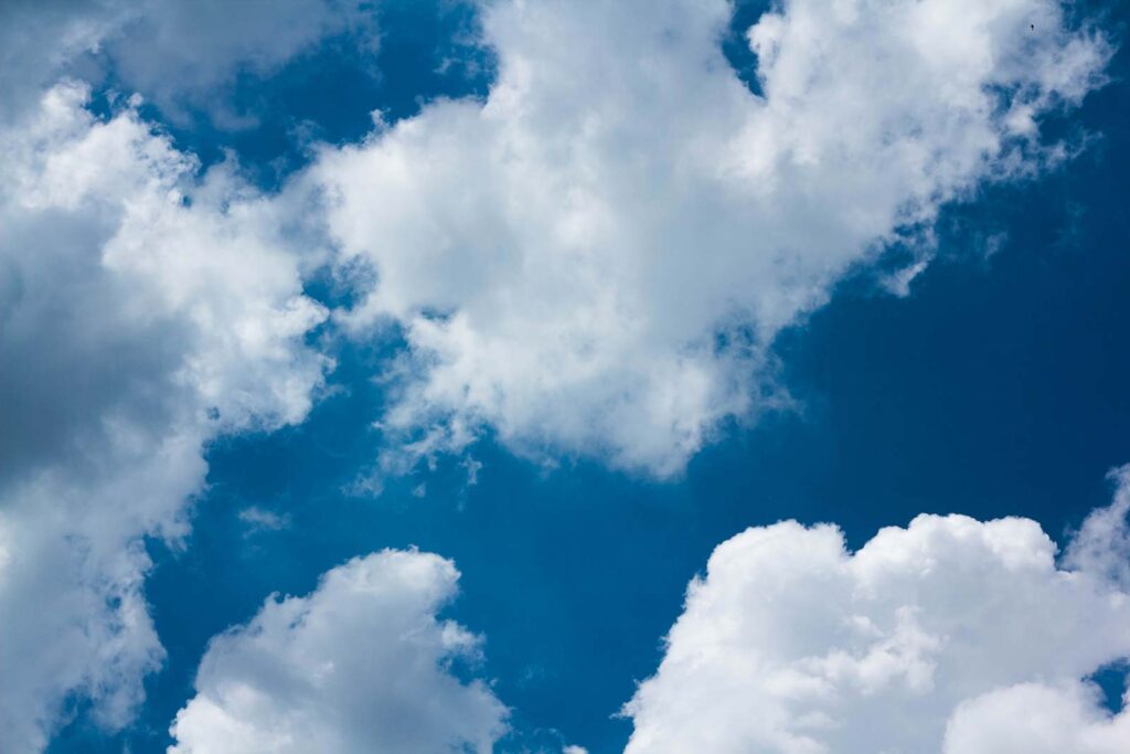 White clouds, bright blue — full design