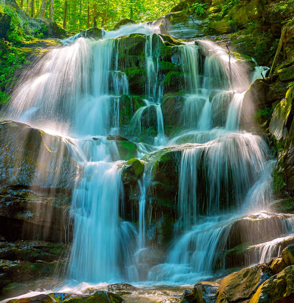 Waterfall over mossy rocks — full design