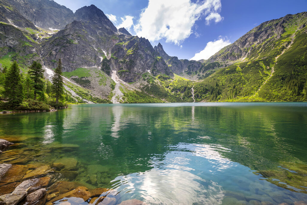 Peaks above clear water — full design
